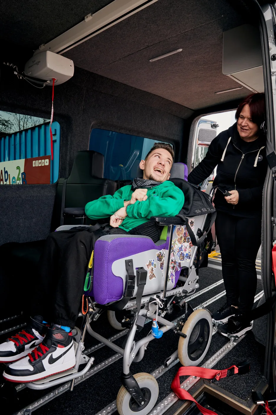 Tyler in his wheelchair inside the adapted Volkswagen Crafter, secured to the floor of the van